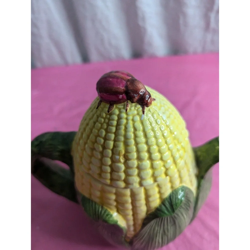 Corn husk teapot with lady bug beetle‎ ? at top  7.5